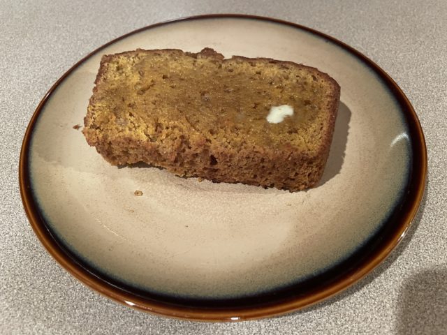 A Slice of Toasted Pumpkin Bread with a Pat of Melted Butter